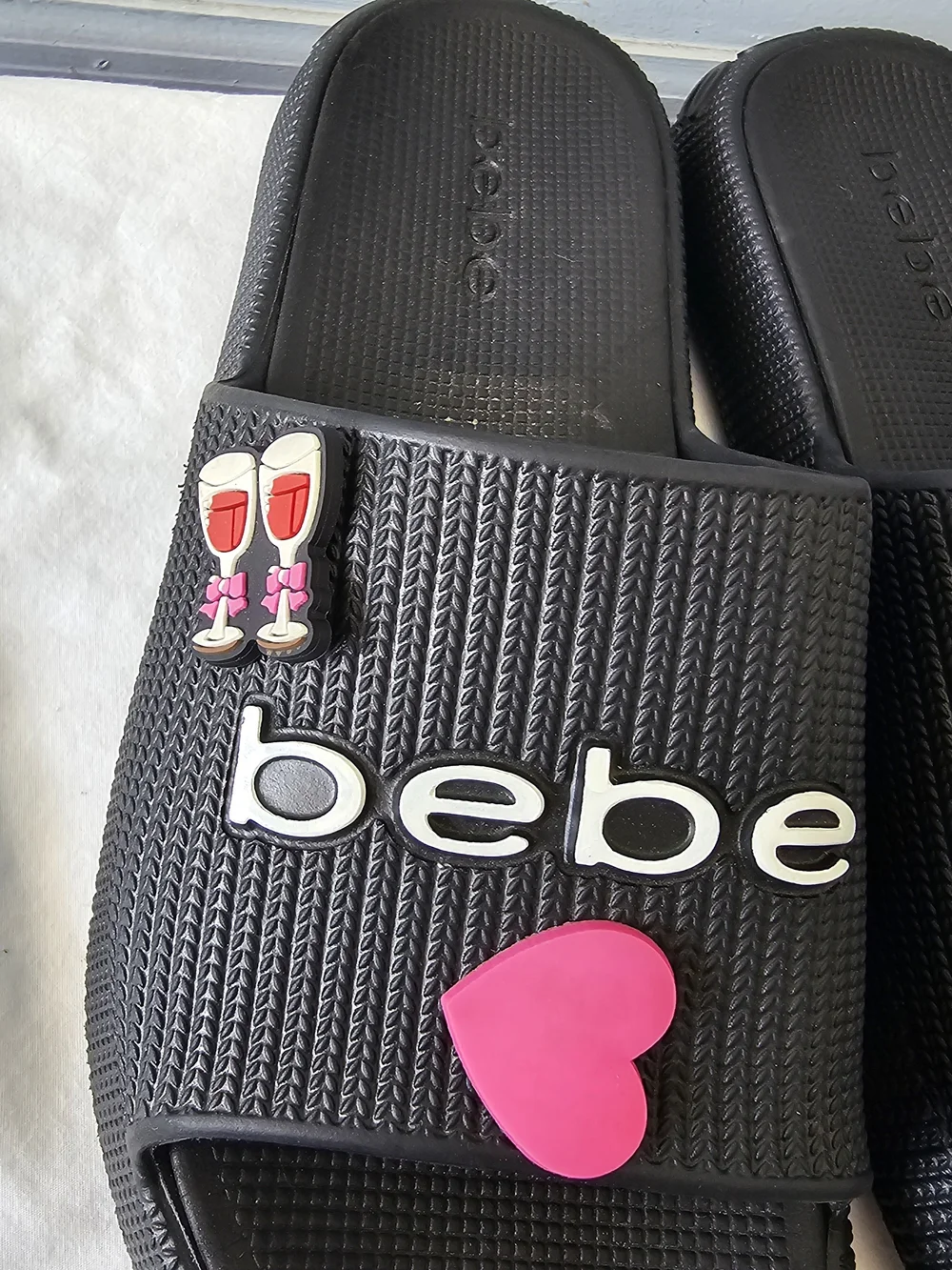 bebe Black Slide Sandals with Pink Heart Accent